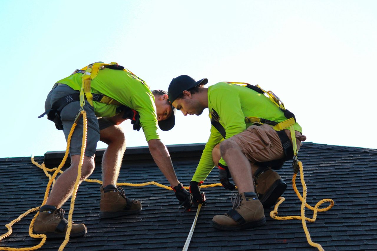 Men installing solar panels